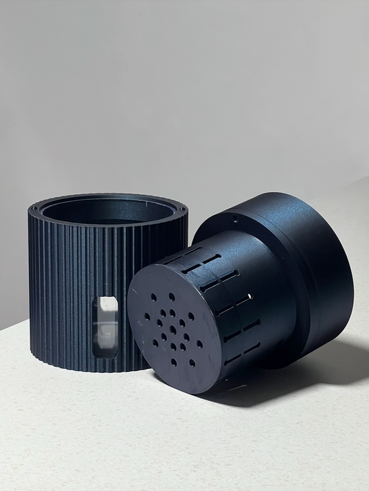 Moria self-watering plant pot in Midnight shown with removable acrylic liner, illustrating the self-watering reservoir system