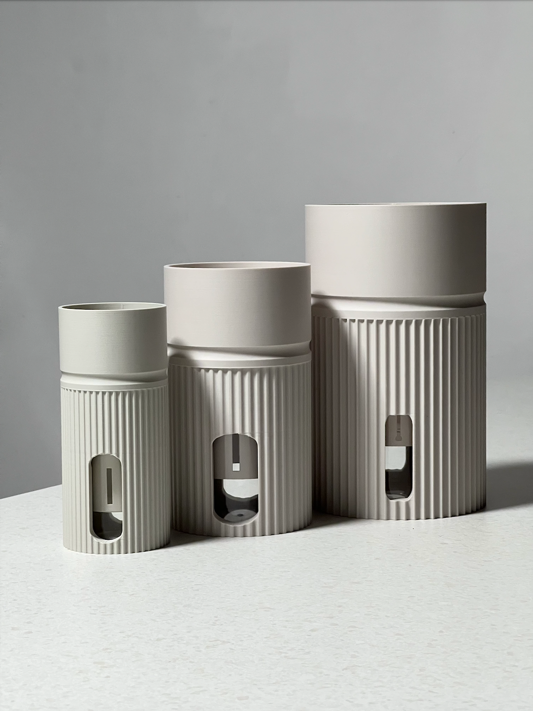 Size comparison of the Maxia, Midia, and Minia self-watering plant pots in Soft Linen — full range of LECA planters by Solvi3D, made in Cornwall UK